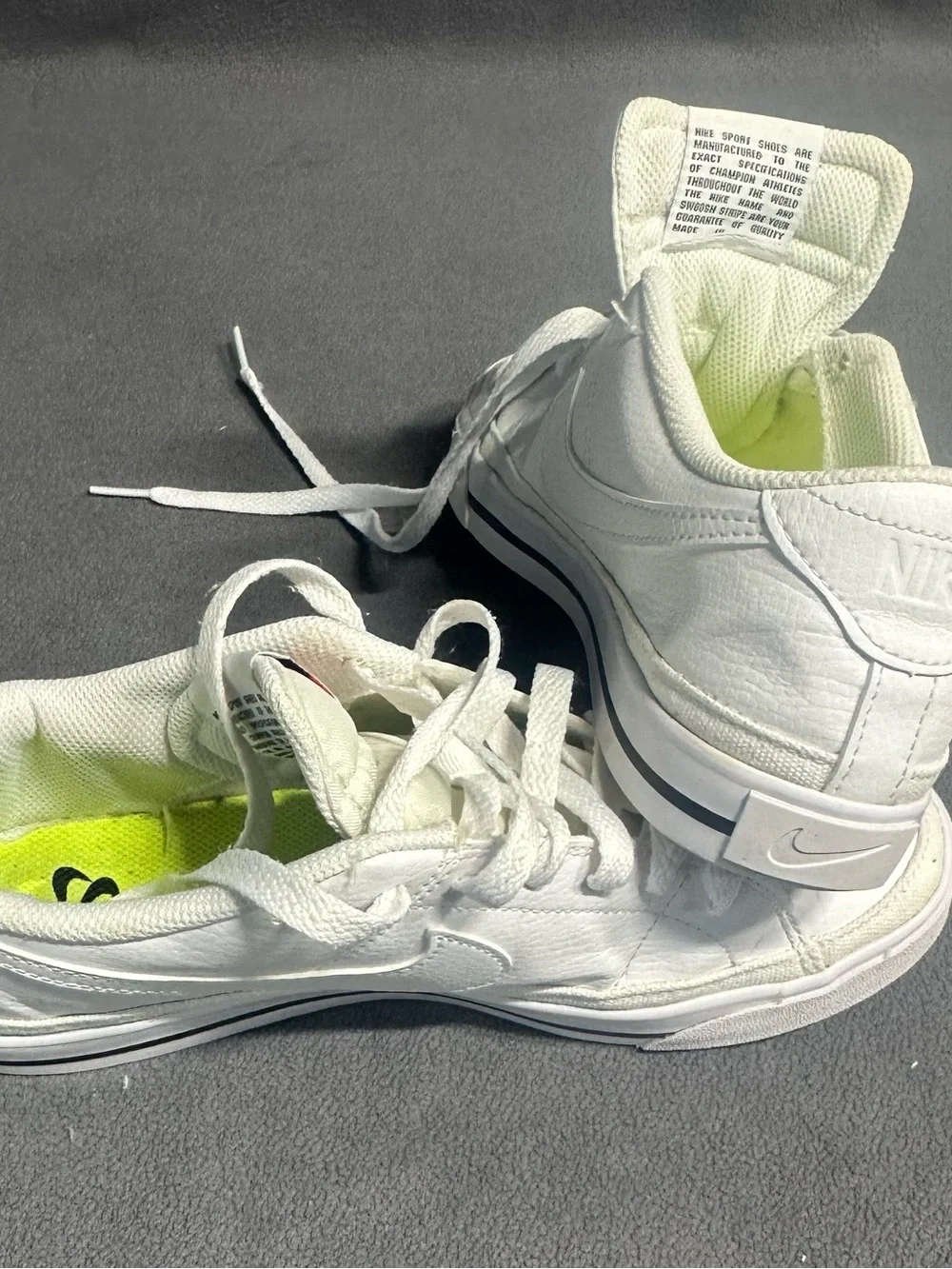 Nike White Mid-Top Sneakers with Orange Swoosh